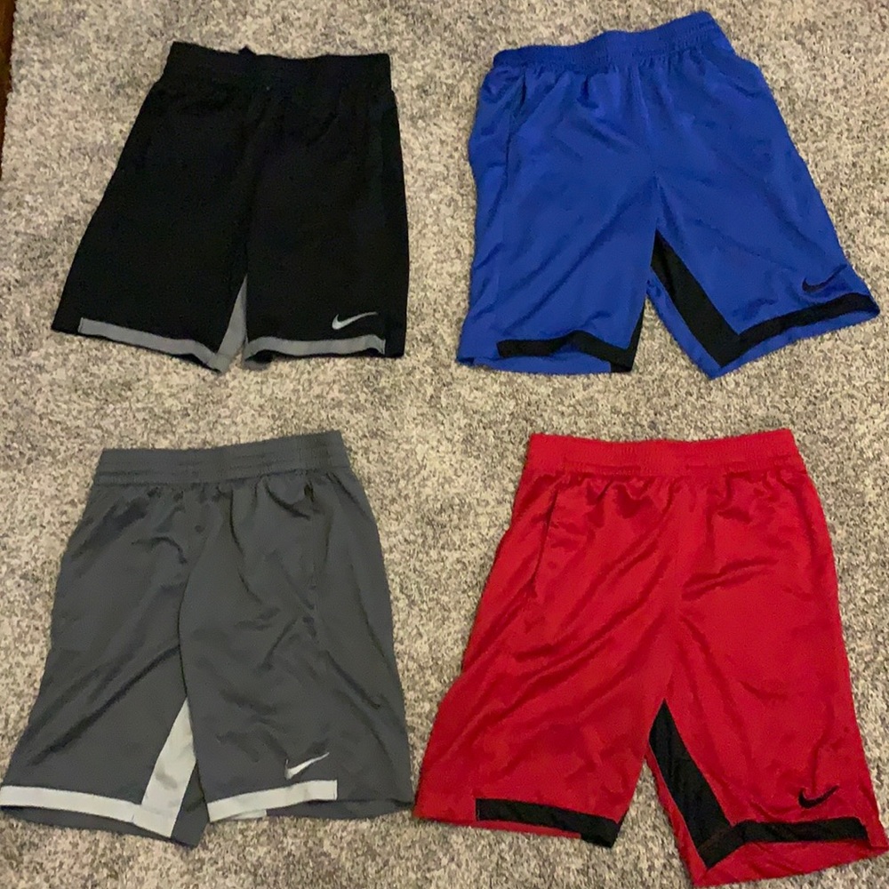 Four pairs of boys Nike shorts